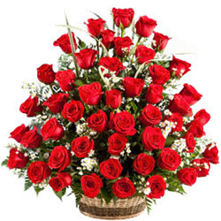 Joyful Presentation of Red Roses in a Lovely Basket