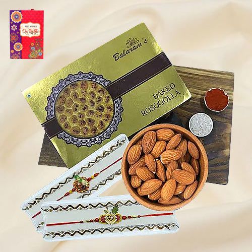 Luscious Rasgulla from Balaram Mullick with Almond N Ethnic Rakhi Pair